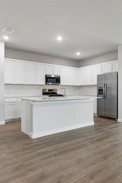 Kitchen in the Oscar home plan by Trophy Signature Homes – REPRESENTATIVE PHOTO