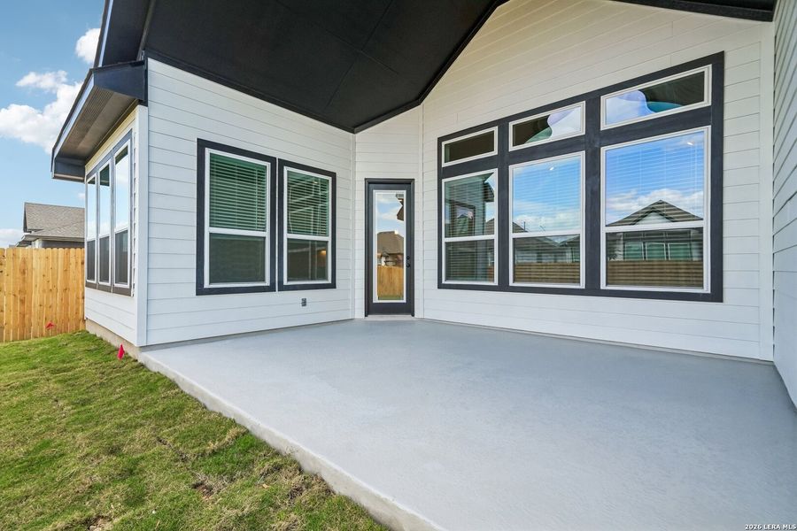Exterior details and patio area of a home in Village at Three Oaks, Seguin (Image 3).