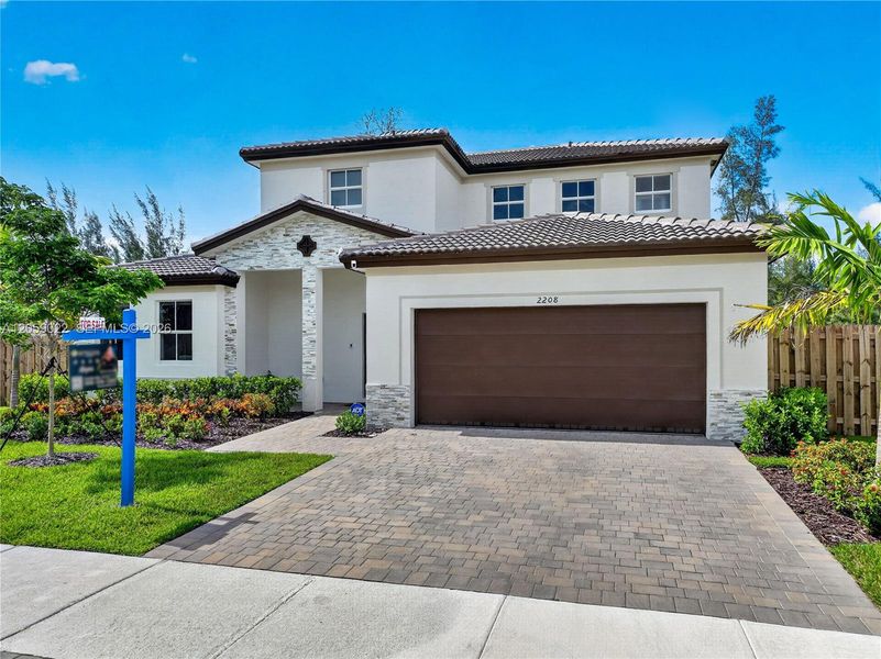 Front exterior of a new home in , Homestead, FL, highlighting curb appeal (Image 29). Front exterior of a new home in , Homestead, FL, highlighting curb appeal (Image 29).