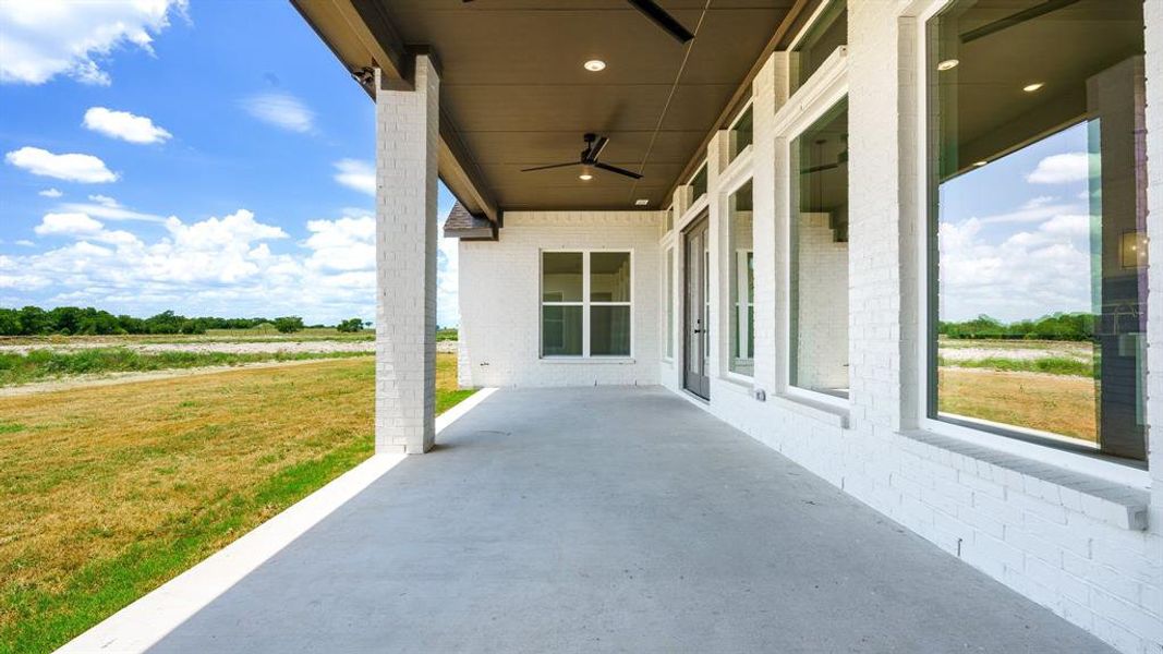 View of patio featuring ceiling fan