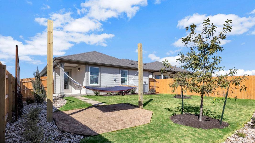 Front exterior of a new home in Prairie Lakes, Buda, TX, highlighting curb appeal (Image 2).