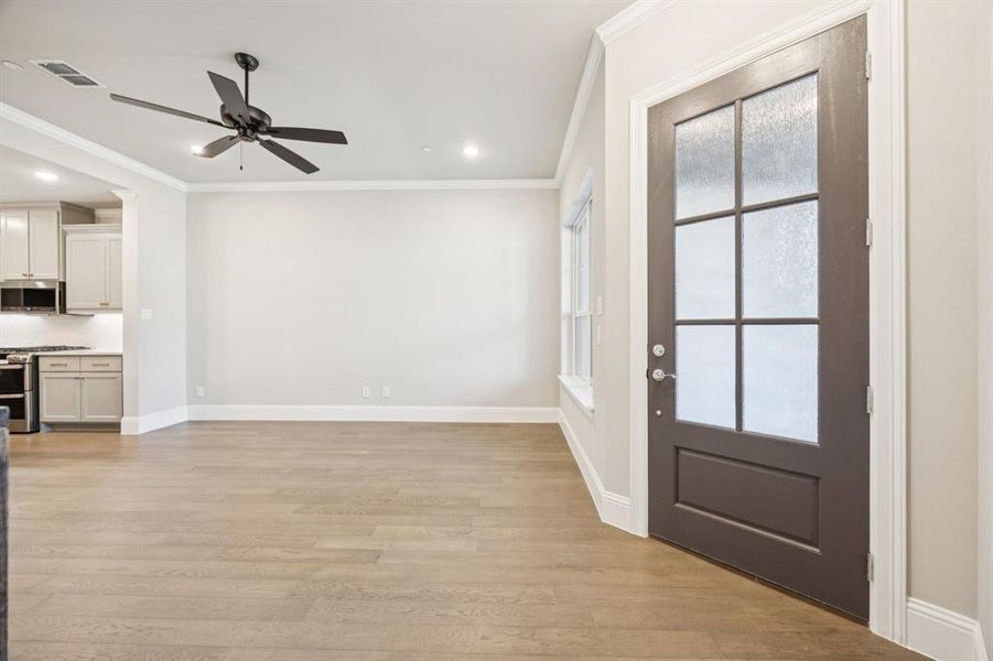 Front door allows for ample natural light to come through to the living room.