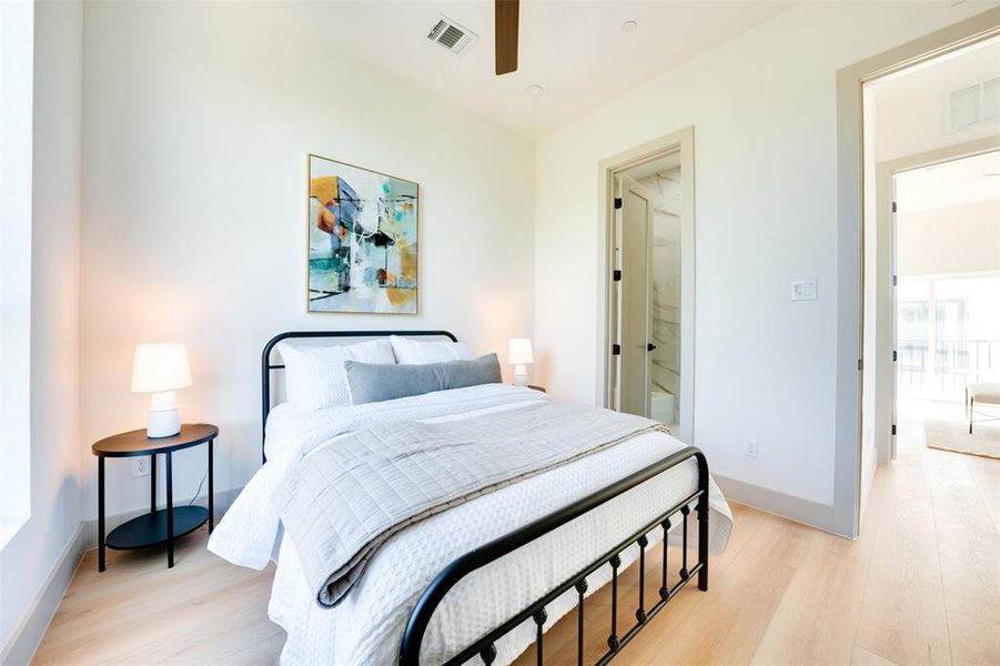 Bedroom featuring light hardwood / wood-style floors and ceiling fan