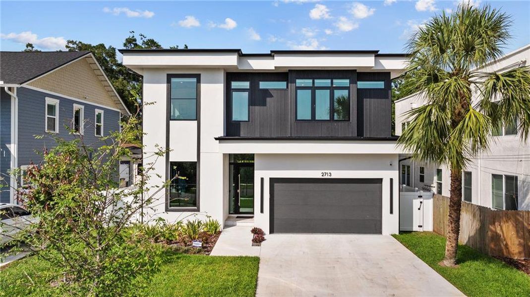 Front exterior of a new home in , Tampa, FL, highlighting curb appeal (Image 1). Front exterior of a new home in , Tampa, FL, highlighting curb appeal (Image 1).