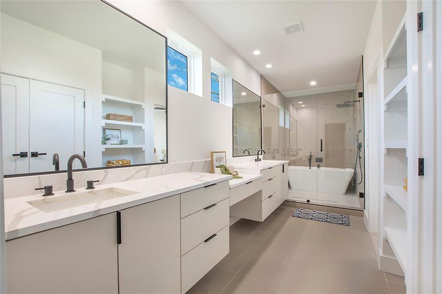 Bathroom featuring tile patterned flooring, vanity, and plus walk in shower