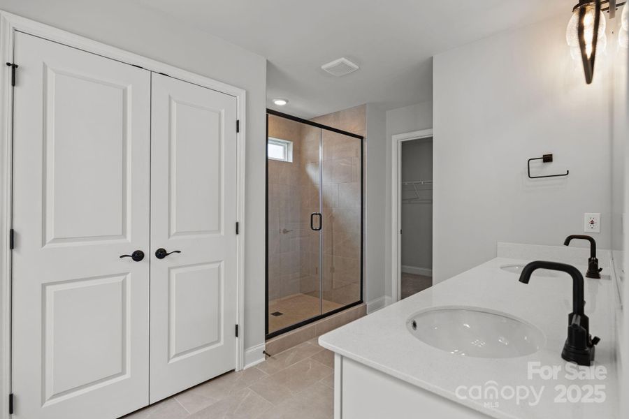 Primary Bath with dual sinks and oversized linen closet
