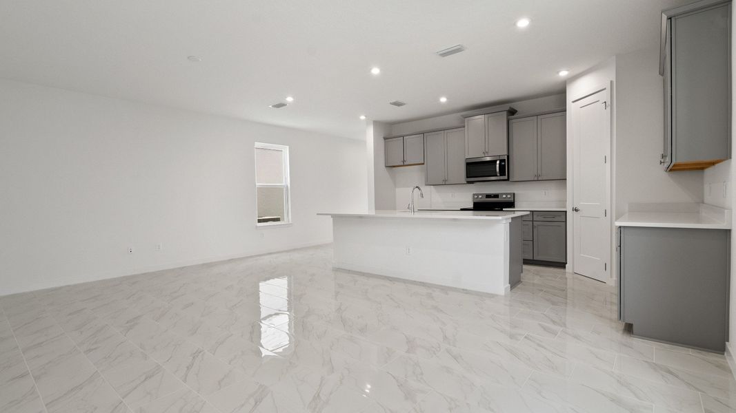 Mandarin view of the Kitchen and Living Area by DRB Homes in Trinity place by DRB Homes Orlando in Saint Cloud, FL Mandarin view of the Kitchen and Living Area by DRB Homes in Trinity place by DRB Homes Orlando in Saint Cloud, FL