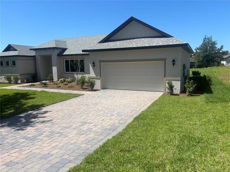 Front exterior of a new home in , Lady Lake, FL, highlighting curb appeal (Image 21).