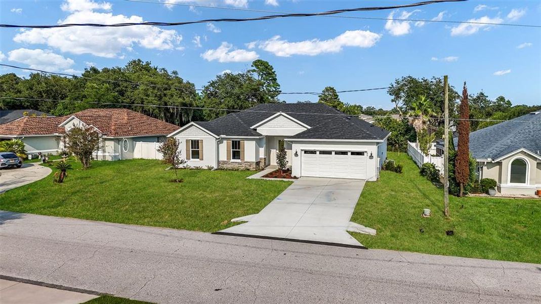Front exterior of a new home in , Palm Coast, FL, highlighting curb appeal (Image 27).