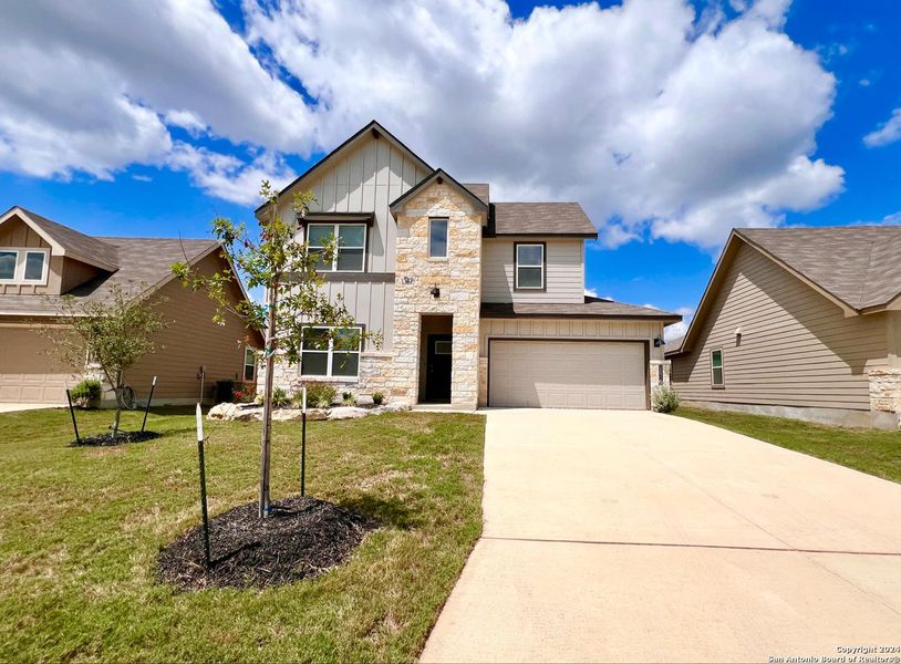 Front exterior of a new home in Brookstone Creek, San Antonio, TX, highlighting curb appeal (Image 26). Front exterior of a new home in Brookstone Creek, San Antonio, TX, highlighting curb appeal (Image 26).