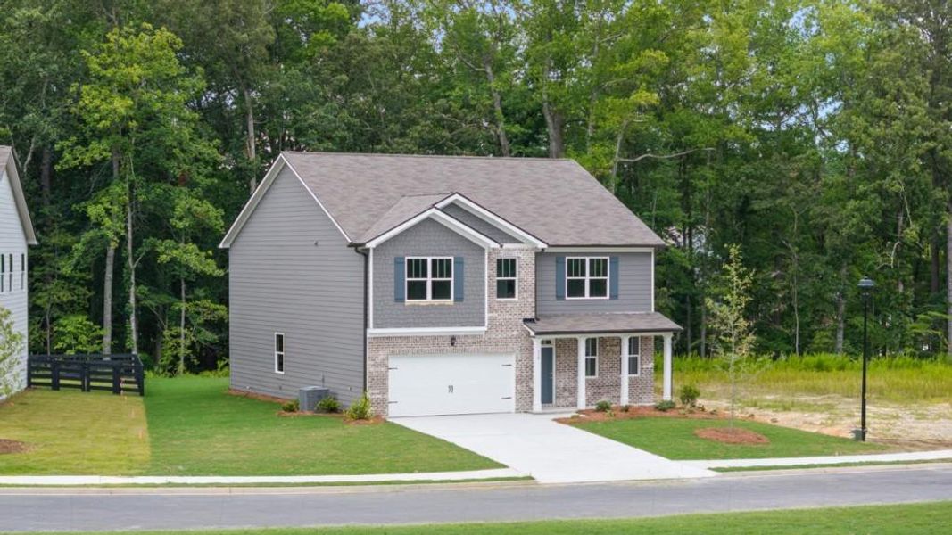 Front exterior of a new home in Northwoods at Mirror Lake, Villa Rica, GA, highlighting curb appeal (Image 2). Front exterior of a new home in Northwoods at Mirror Lake, Villa Rica, GA, highlighting curb appeal (Image 2).