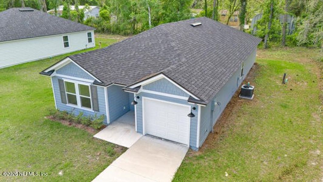 Front exterior of a new home in , Satsuma, FL, highlighting curb appeal (Image 25).