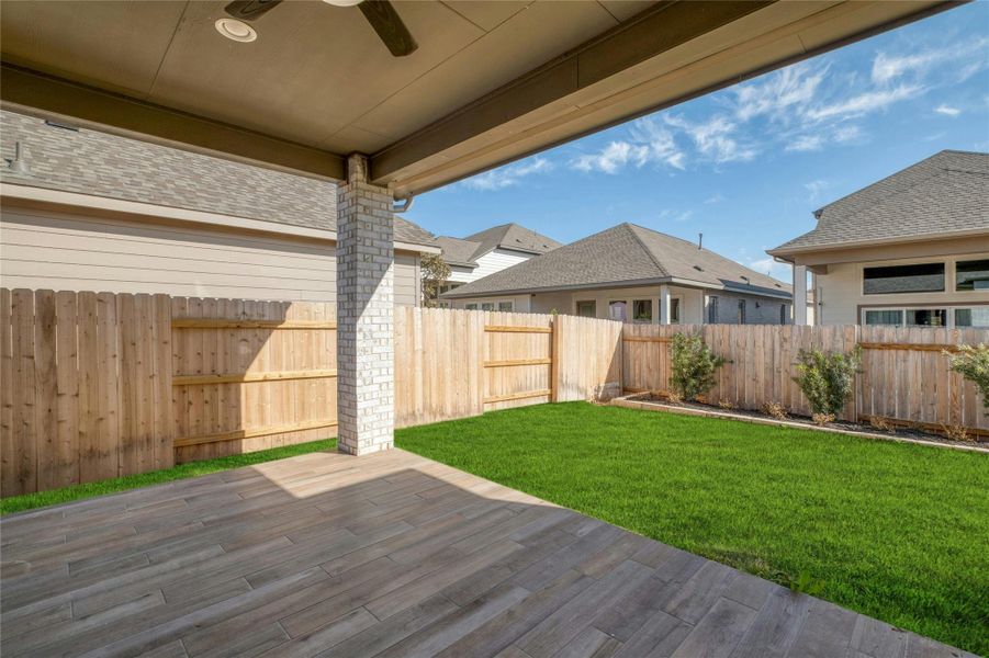 Exterior details and patio area of a home in Lariat 45', Liberty Hill (Image 18).
