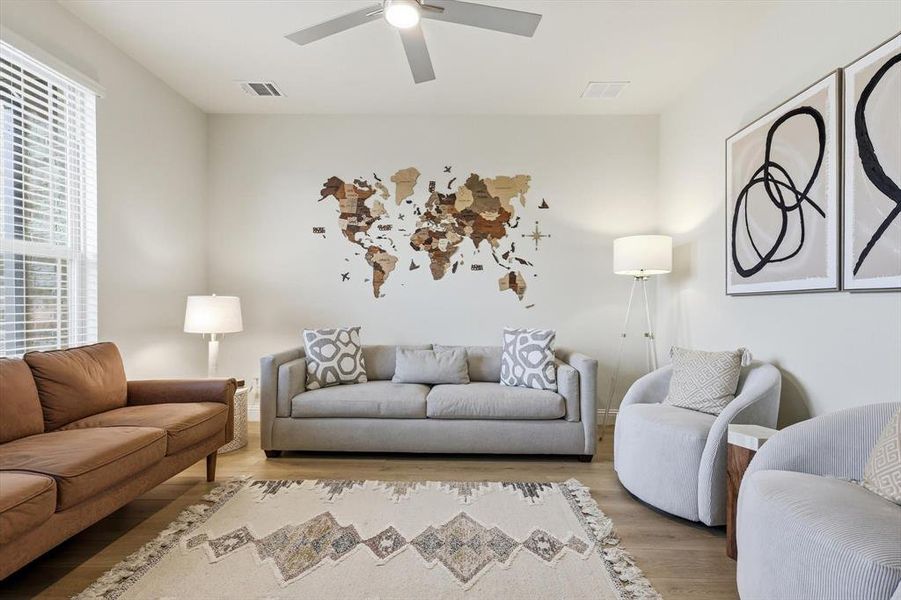 Office room with plenty of natural light, a ceiling fan and a beautiful view of the neighborhood