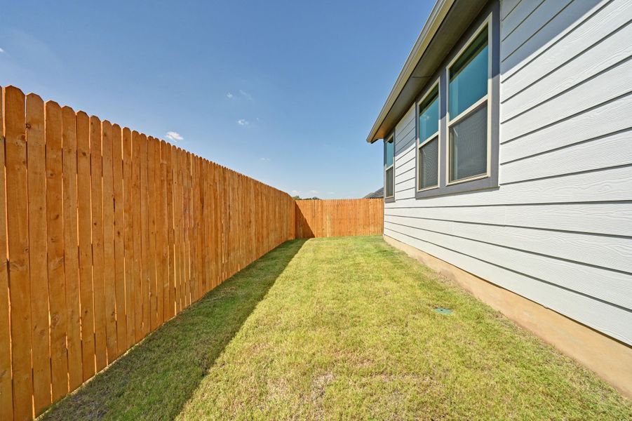 Exterior details and patio area of a home in Trinity Ranch, Elgin (Image 20).