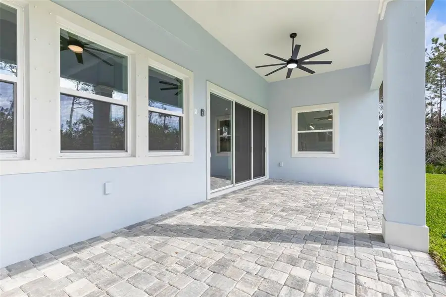 Exterior details and patio area of a home in Palm Coast Plantation, Palm Coast (Image 3).