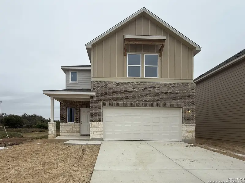 Front exterior of a new home in Meadows at Hennersby Hollow 40's, San Antonio, TX, highlighting curb appeal (Image 1).