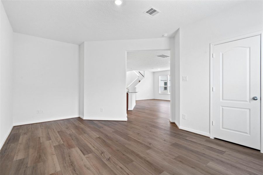 The Den features custom neutral paint, recessed lighting, large window with blinds, closet space, and the continuous flow of the vinyl plank flooring. The Den features custom neutral paint, recessed lighting, large window with blinds, closet space, and the continuous flow of the vinyl plank flooring.