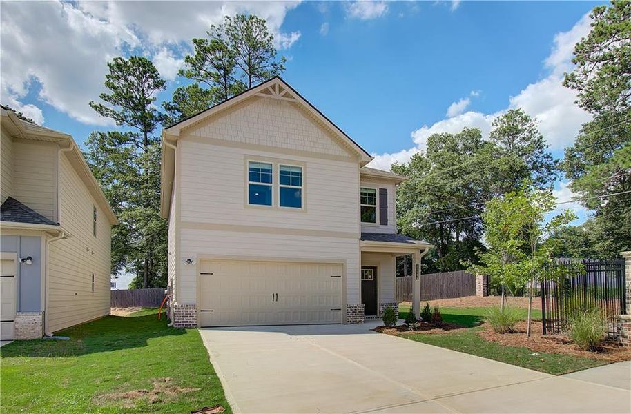 Front exterior of a new home in Towne Center, Hampton, GA, highlighting curb appeal (Image 16).
