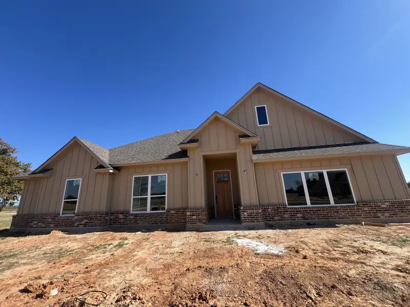 Front exterior of a new home in Zion Valley, Poolville, TX, highlighting curb appeal (Image 1). Front exterior of a new home in Zion Valley, Poolville, TX, highlighting curb appeal (Image 1).