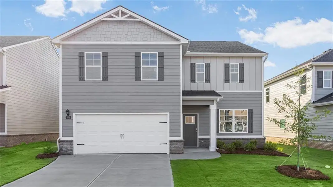 Front exterior of a new home in Poplar Preserve, Newnan, GA, highlighting curb appeal (Image 1). Front exterior of a new home in Poplar Preserve, Newnan, GA, highlighting curb appeal (Image 1).