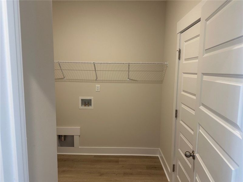 This dedicated laundry space offers convenience an