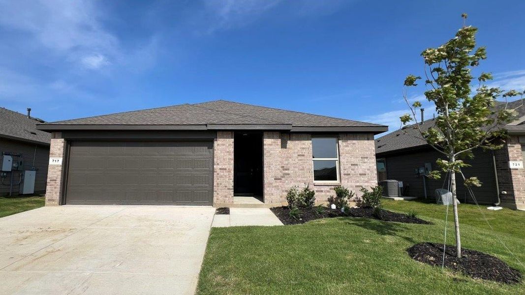 Front exterior of a new home in Monarch at the Meadows, Ponder, TX, highlighting curb appeal (Image 1). Front exterior of a new home in Monarch at the Meadows, Ponder, TX, highlighting curb appeal (Image 1).
