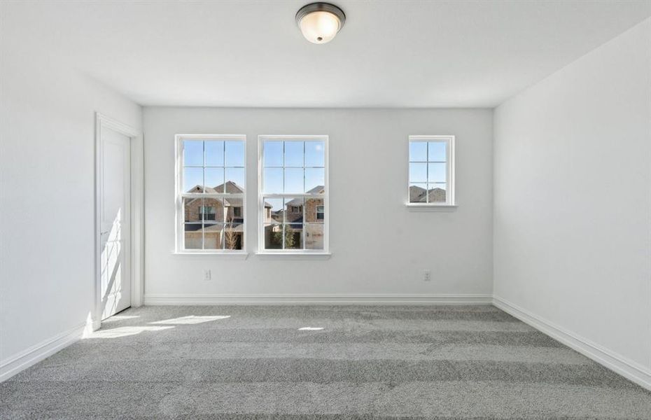 Spacious secondary bedroom with large windows