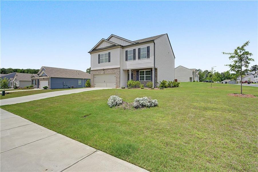 Front exterior of a new home in Oakwood, Dallas, GA, highlighting curb appeal (Image 29).