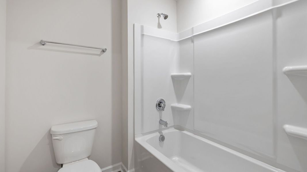 Furnished interior view inside a new home in Bentley Park, Greenwood (Image 13).