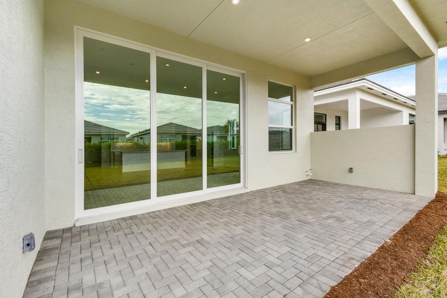 Exterior details and patio area of a home in PGA Village Verano, Port St. Lucie (Image 2).