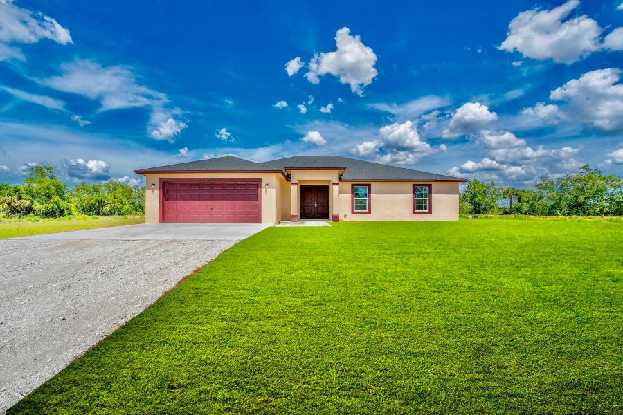Front exterior of a new home in , Loxahatchee, FL, highlighting curb appeal (Image 16).