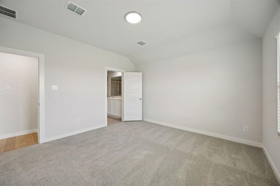 Primary Suite in the Hadley home plan by Trophy Signature Homes – REPRESENTATIVE PHOTO