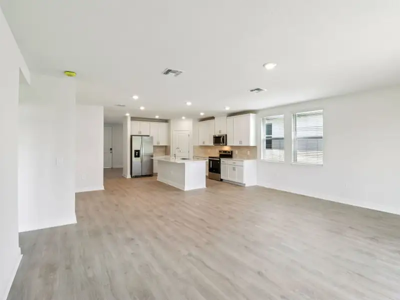 Spacious, unfurnished interior of a new home in The Reserve at Hammock Oaks - Signature Series, Lady Lake (Image 9).