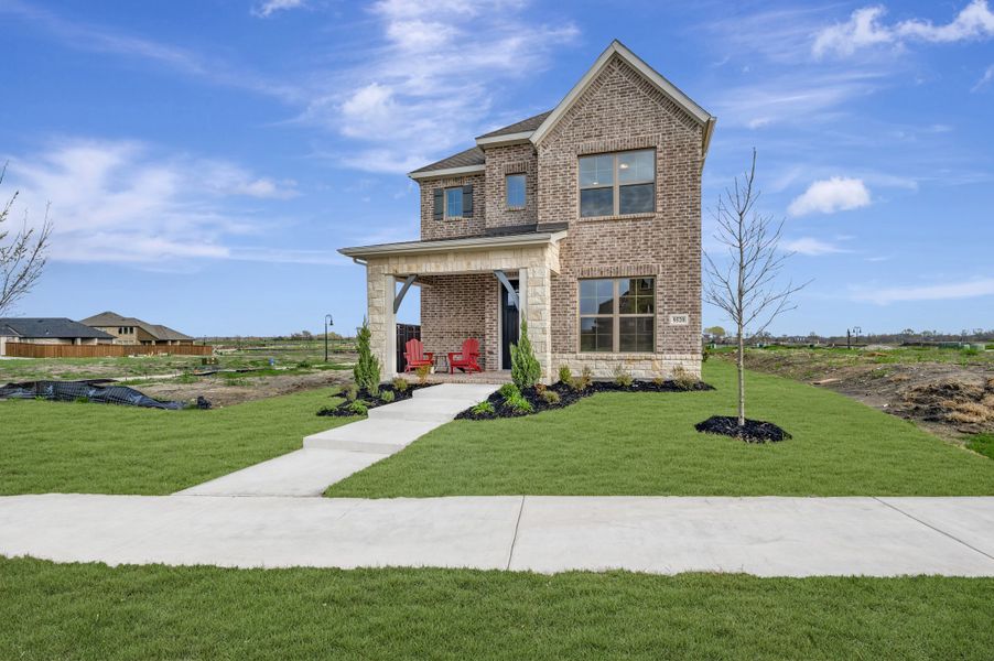 Front exterior of a new home in Talia – Cottage Series, Mesquite, TX, highlighting curb appeal (Image 1). Front exterior of a new home in Talia – Cottage Series, Mesquite, TX, highlighting curb appeal (Image 1).