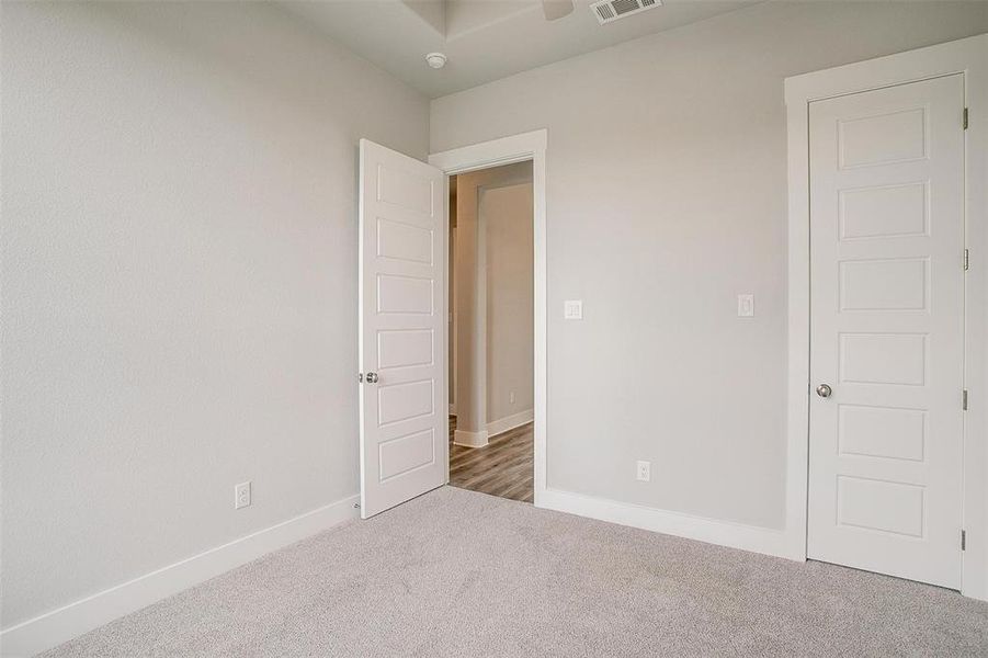 Unfurnished bedroom with carpet floors