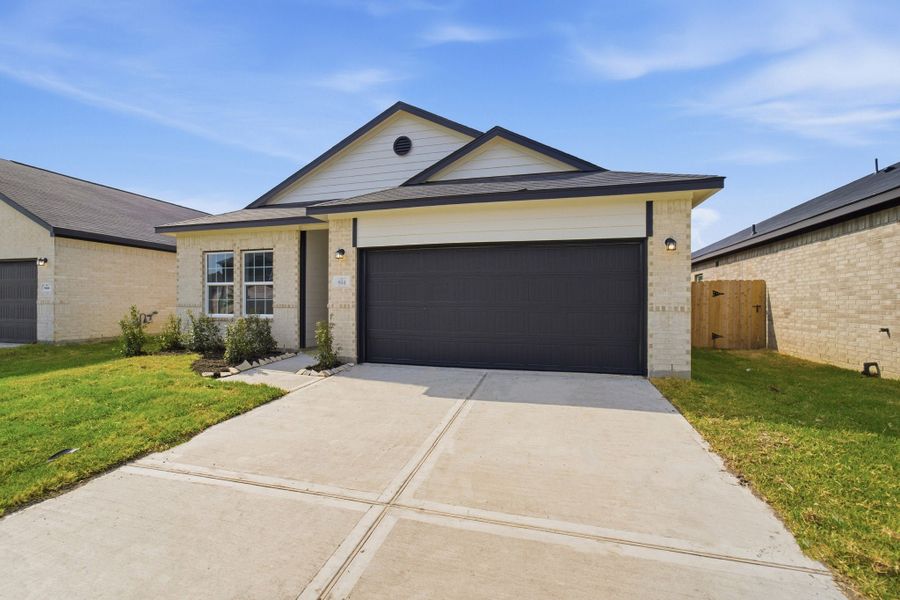Front exterior of a new home in Pecan Estates, Crosby, TX, highlighting curb appeal (Image 2).