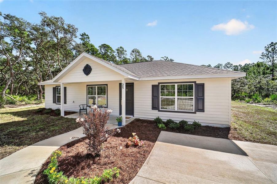 Front exterior of a new home in , Ocklawaha, FL, highlighting curb appeal (Image 20).