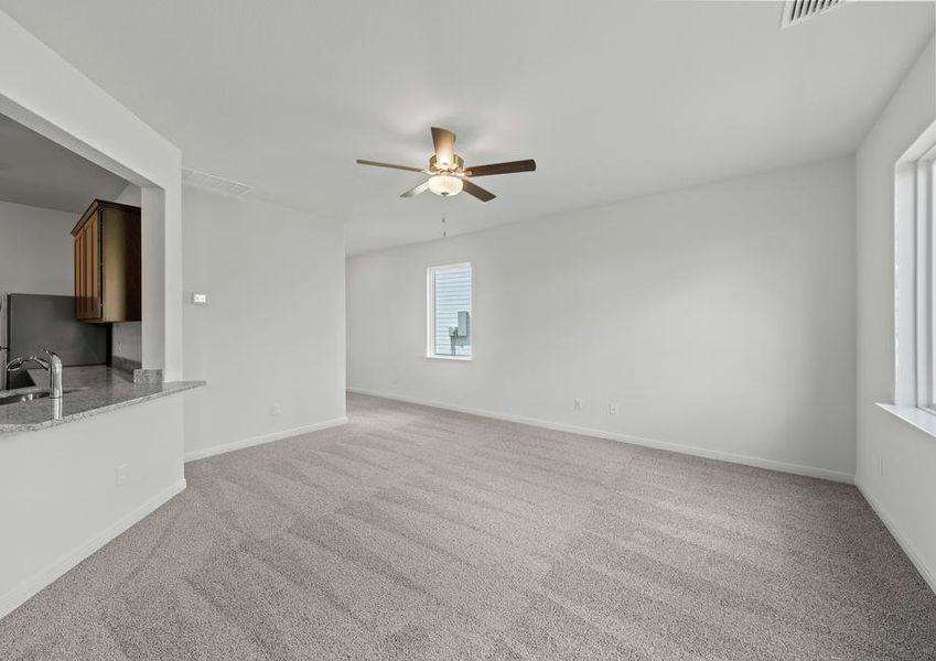 The spacious family room is perfect for family living and hosting.