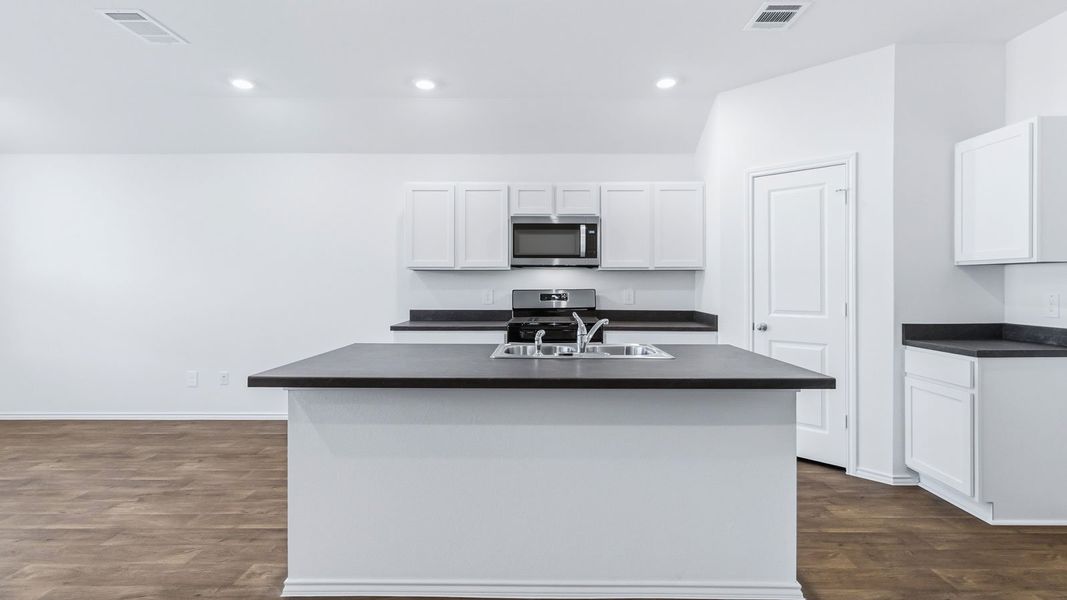 Representative furnished interior of a home built from the The Easton by D.R. Horton in Wayside, Uhland (Image 6).