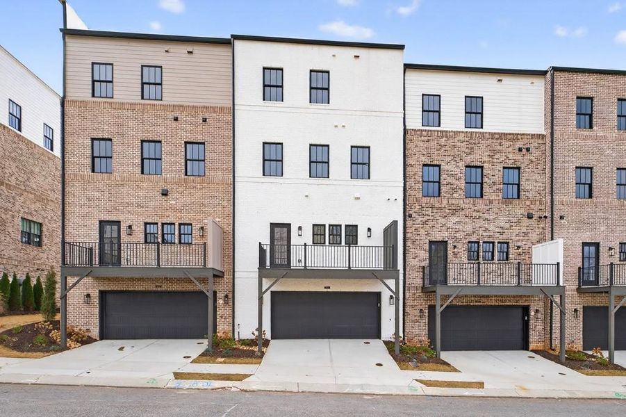 Front exterior of a new home in Skyview On Broad, Sugar Hill, GA, highlighting curb appeal (Image 1). Front exterior of a new home in Skyview On Broad, Sugar Hill, GA, highlighting curb appeal (Image 1).