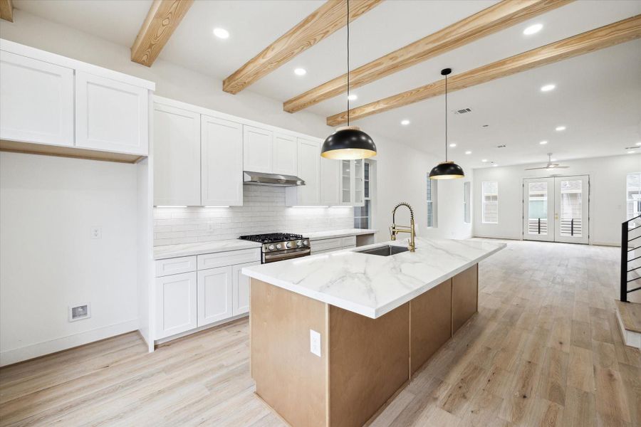 Kitchen option with black island pendants in another home.