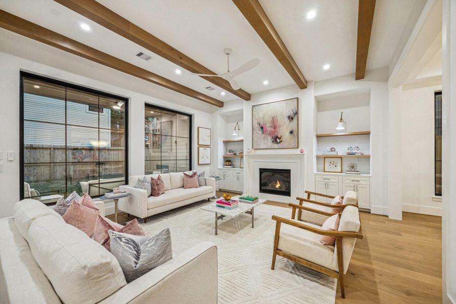 Wow! What a beautiful Family Room with a wall of windows, stained oak boxed beams and a MinkaAire Roto XL 62" 3 Blade Ceiling Fan.