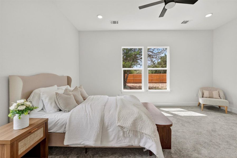 Bedroom featuring carpet flooring, ceiling fan, and recessed lighting
