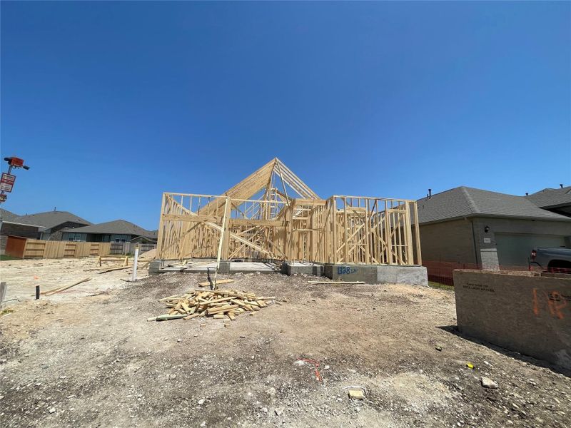 Front exterior of a new home in Berry Creek Highlands, Georgetown, TX, highlighting curb appeal (Image 14).