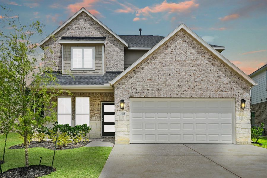 Front exterior of a new home in Grand Oaks – The Cove, Houston, TX, highlighting curb appeal (Image 16). Front exterior of a new home in Grand Oaks – The Cove, Houston, TX, highlighting curb appeal (Image 16).