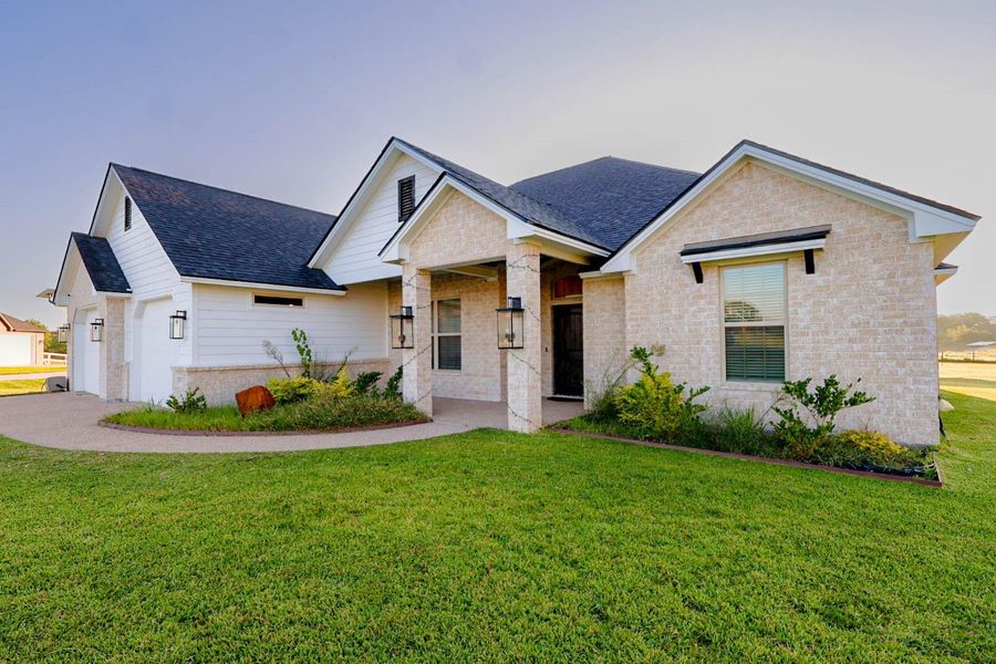 Front exterior of a new home in , Bryan, TX, highlighting curb appeal (Image 18).