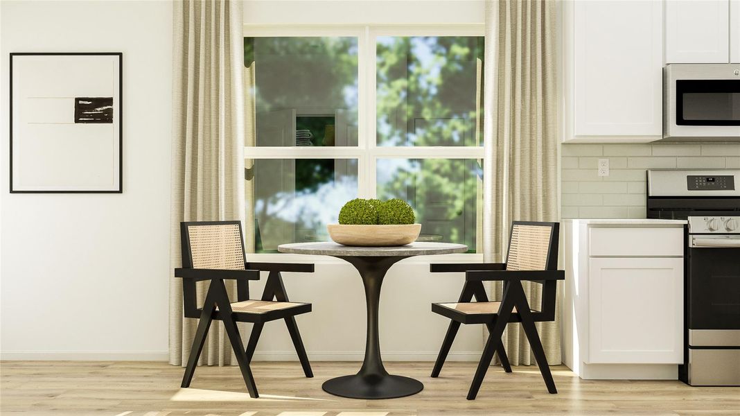 Dining area with light wood-type flooring and baseboards Dining area with light wood-type flooring and baseboards