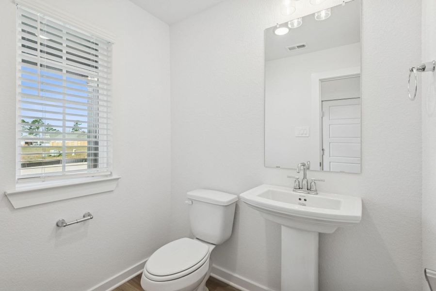Furnished interior view inside a new home in Lone Star Landing, Montgomery (Image 9).