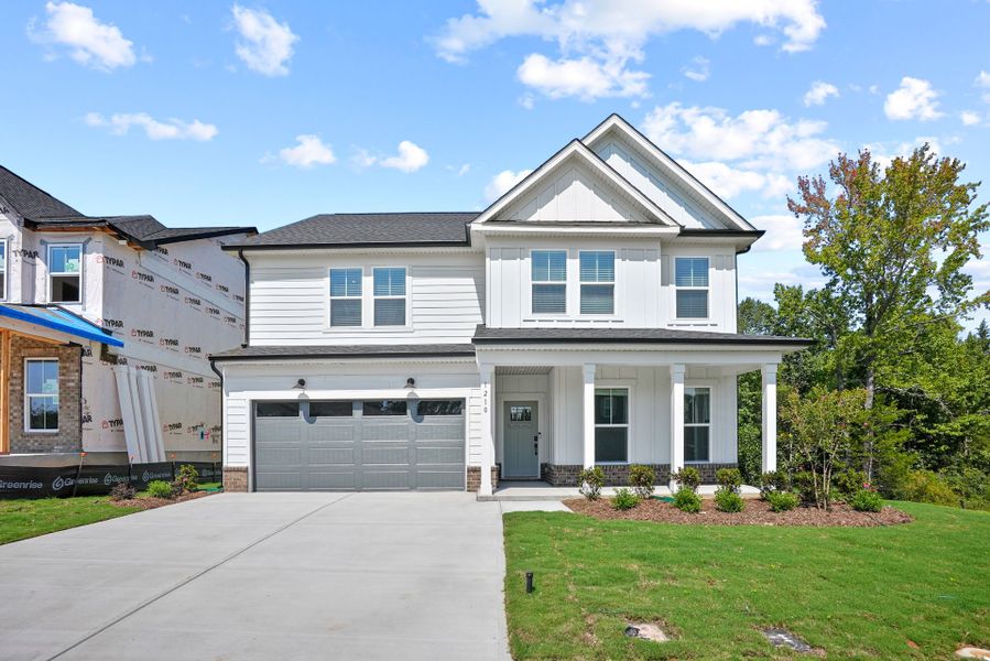 Front exterior of a new home in Elmbrook, Indian Trail, NC, highlighting curb appeal (Image 31). Front exterior of a new home in Elmbrook, Indian Trail, NC, highlighting curb appeal (Image 31).